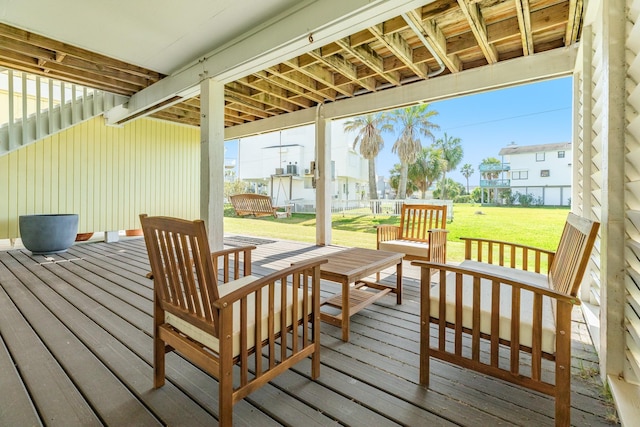 wooden deck featuring a yard, a residential view, and outdoor lounge area