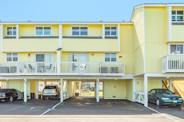 view of building exterior with covered parking