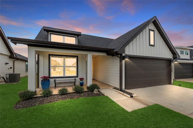 view of front of home featuring board and batten siding, a porch, central AC unit, driveway, and an attached garage