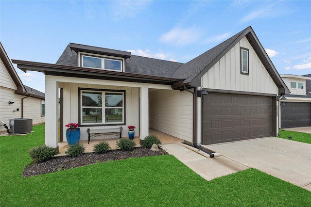 view of front of home featuring board and batten siding, central air condition unit, a porch, concrete driveway, and roof with shingles