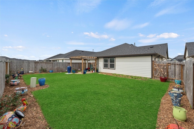 rear view of house with a lawn, a pergola, a fenced backyard, and roof with shingles