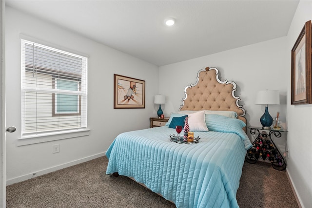 bedroom with baseboards and carpet flooring