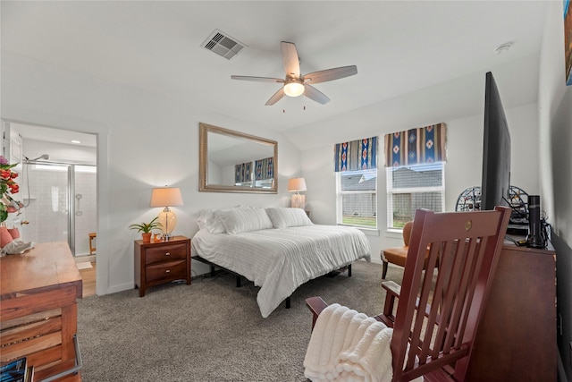 bedroom with visible vents, ceiling fan, baseboards, carpet, and ensuite bath