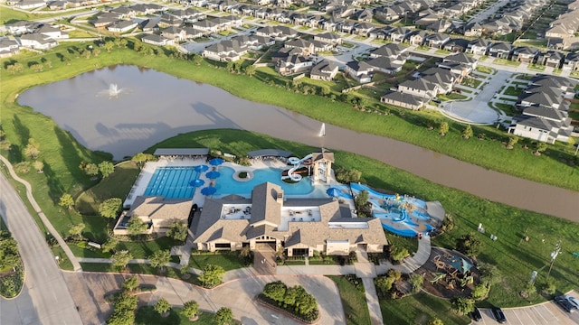 birds eye view of property featuring a residential view and a water view