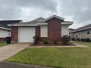 view of front facade featuring concrete driveway, brick siding, a garage, and a front yard