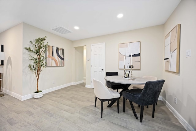 dining room featuring visible vents, recessed lighting, baseboards, and wood finished floors