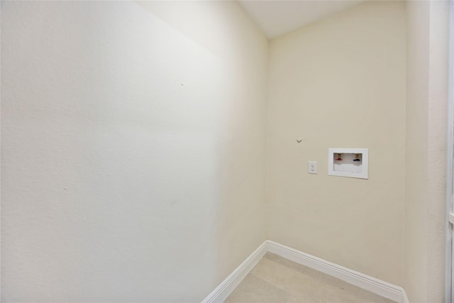 clothes washing area featuring washer hookup, laundry area, and baseboards