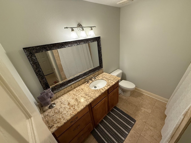 bathroom with tile patterned floors, visible vents, toilet, baseboards, and vanity