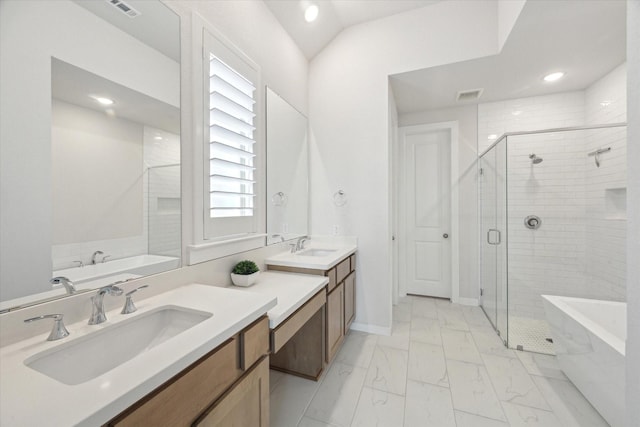 bathroom with visible vents, a soaking tub, marble finish floor, and a stall shower