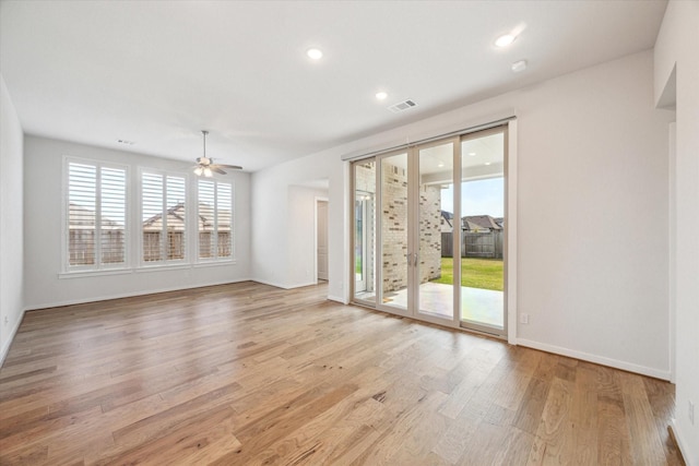 empty room with baseboards, visible vents, recessed lighting, ceiling fan, and light wood-type flooring