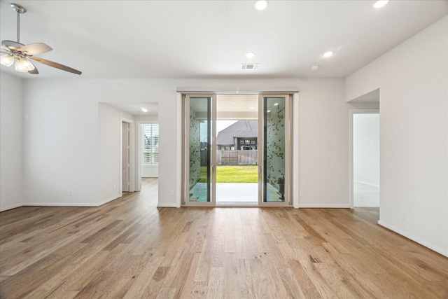 unfurnished room featuring baseboards, visible vents, recessed lighting, ceiling fan, and light wood-type flooring