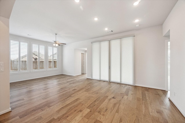 unfurnished living room featuring a ceiling fan, visible vents, light wood finished floors, baseboards, and recessed lighting