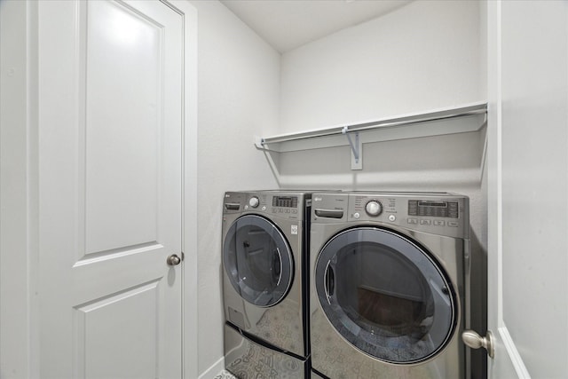 washroom with laundry area and separate washer and dryer