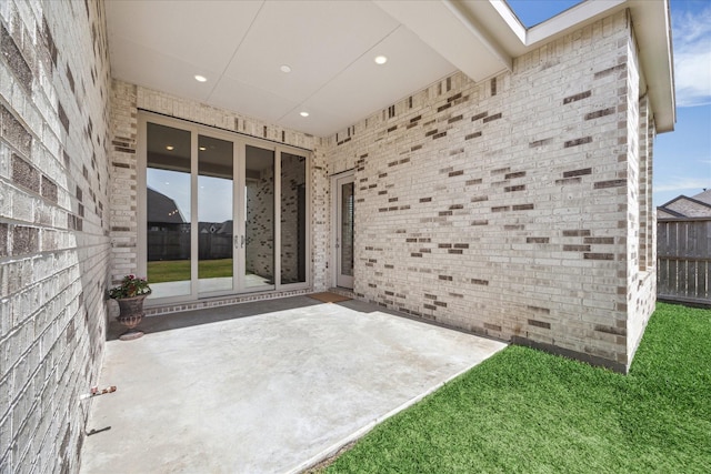 view of patio featuring fence