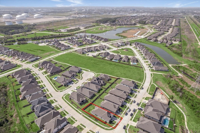 bird's eye view featuring a residential view and a water view