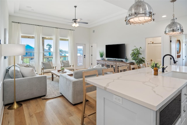 living room with light wood finished floors, recessed lighting, and ceiling fan