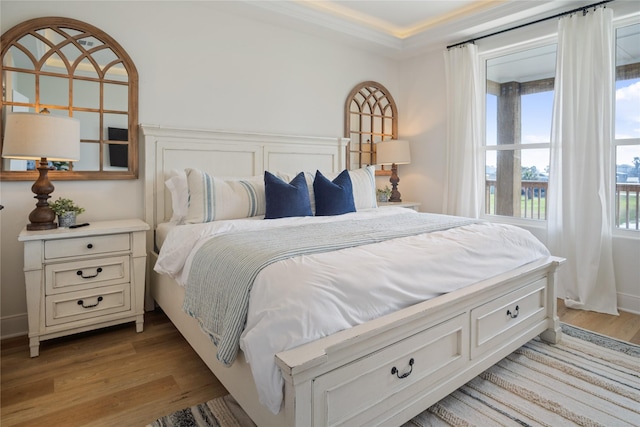 bedroom featuring light wood-type flooring and baseboards