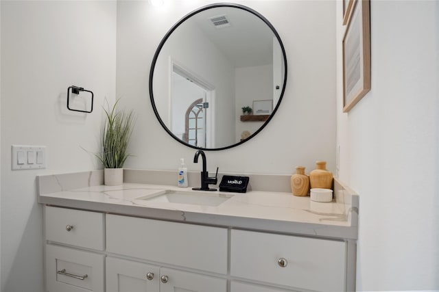 bathroom featuring visible vents and vanity