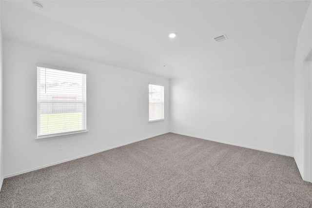 carpeted empty room with visible vents, recessed lighting, and baseboards