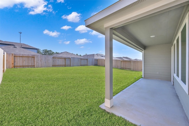 view of yard featuring a patio area and a fenced backyard