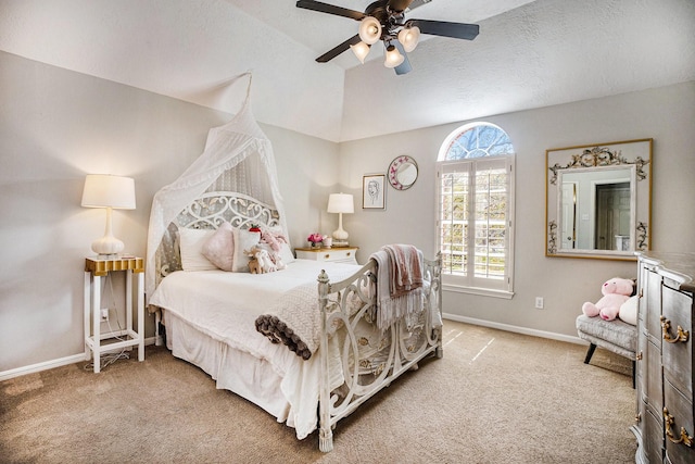 bedroom featuring a ceiling fan, baseboards, carpet floors, vaulted ceiling, and a textured ceiling