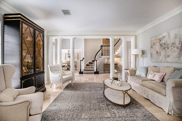 living room with stairway, visible vents, ornate columns, a textured ceiling, and crown molding