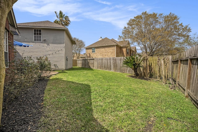 view of yard with a fenced backyard