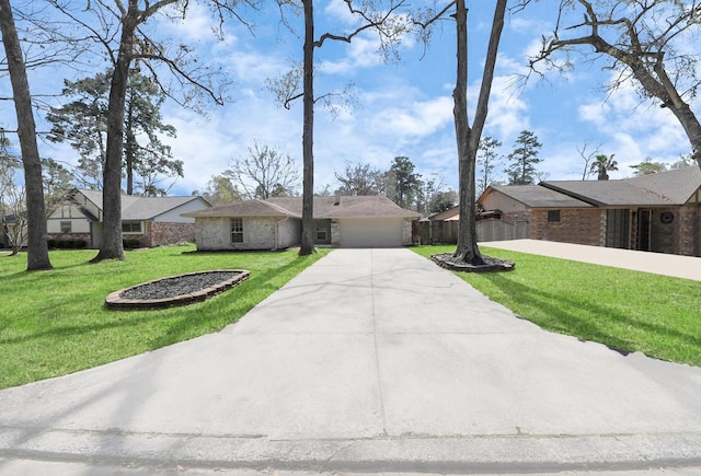 ranch-style house with a front lawn, fence, a garage, and driveway