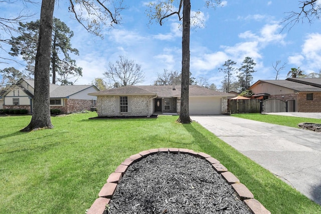 single story home with a front yard, a gate, fence, driveway, and a garage