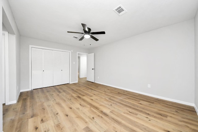 unfurnished bedroom featuring light wood-type flooring, visible vents, and baseboards