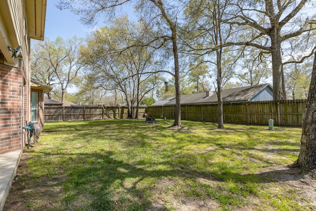 view of yard with a fenced backyard