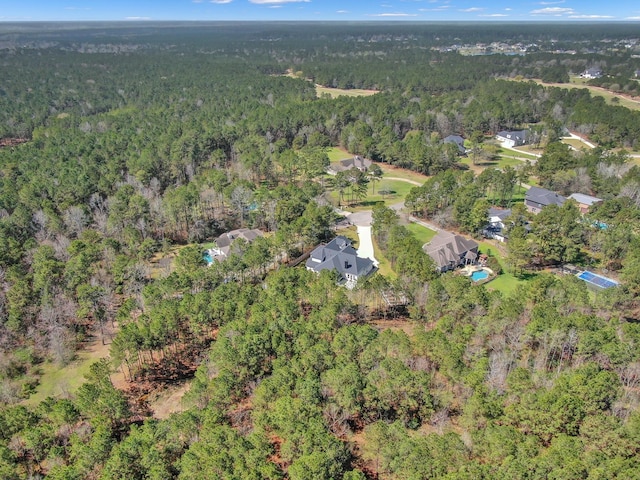 bird's eye view with a forest view