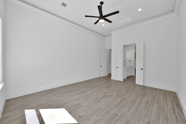 unfurnished bedroom with wood finished floors, visible vents, baseboards, recessed lighting, and ornamental molding