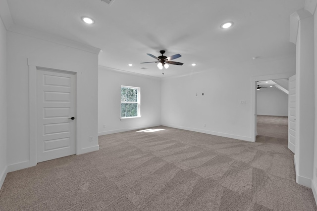 spare room with recessed lighting, a ceiling fan, baseboards, and light carpet