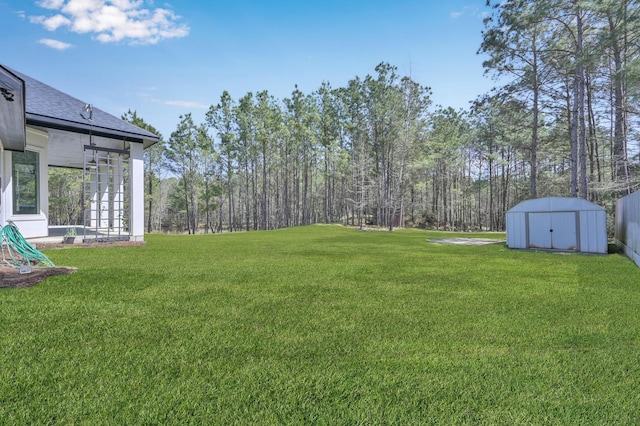 view of yard featuring an outbuilding and a shed