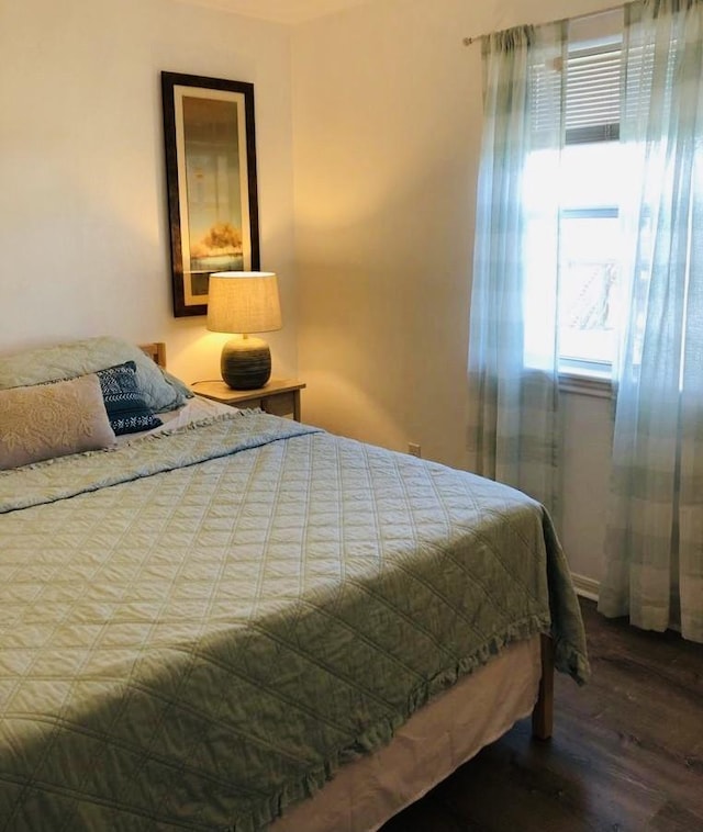 bedroom with wood finished floors