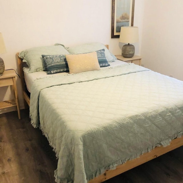 bedroom with wood finished floors