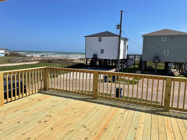 wooden deck featuring a water view