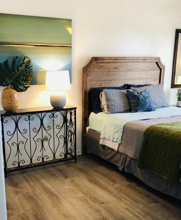 bedroom featuring wood finished floors