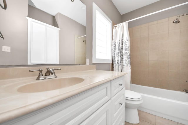 bathroom with tile patterned flooring, toilet, vanity, and shower / bath combo