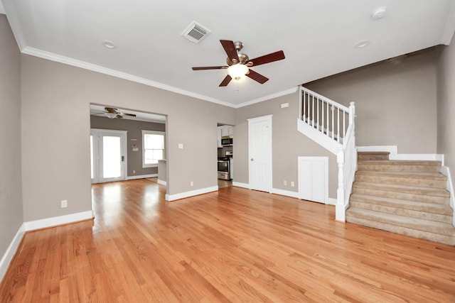 unfurnished living room with visible vents, a ceiling fan, stairway, light wood-style floors, and baseboards