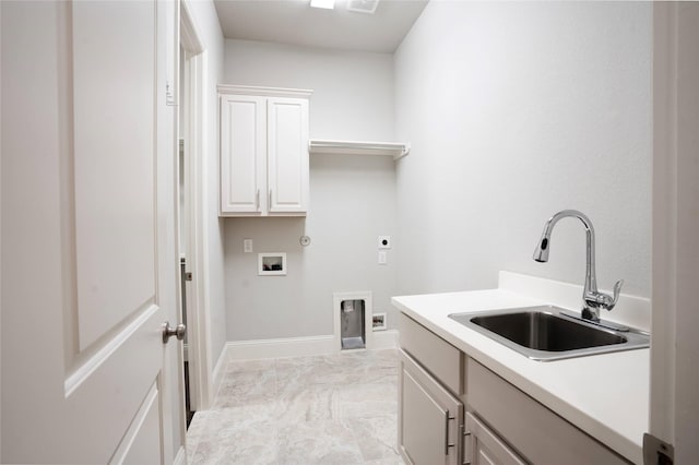 clothes washing area featuring hookup for a washing machine, baseboards, hookup for an electric dryer, cabinet space, and a sink