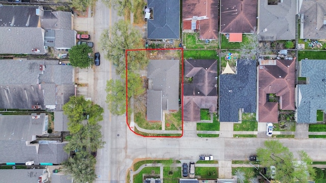 birds eye view of property with a residential view