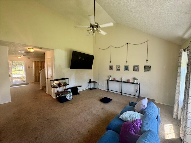 carpeted living area with high vaulted ceiling, a textured ceiling, and a ceiling fan