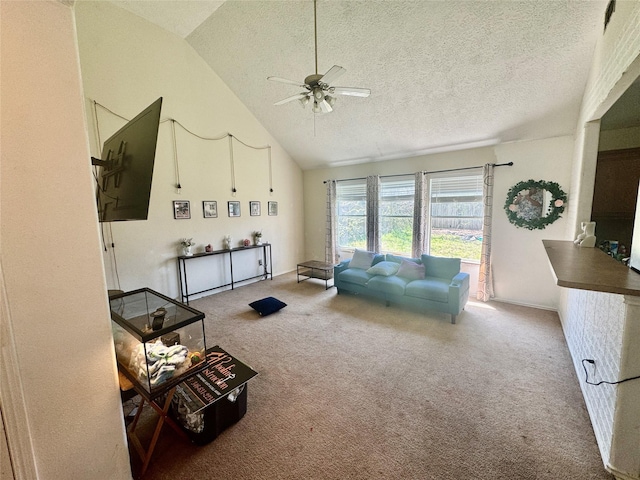 living room featuring a textured ceiling, high vaulted ceiling, carpet, and ceiling fan