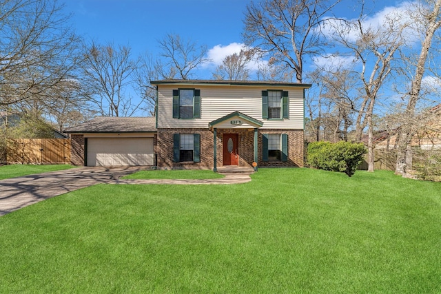 view of front of home with brick siding, fence, concrete driveway, a front yard, and an attached garage