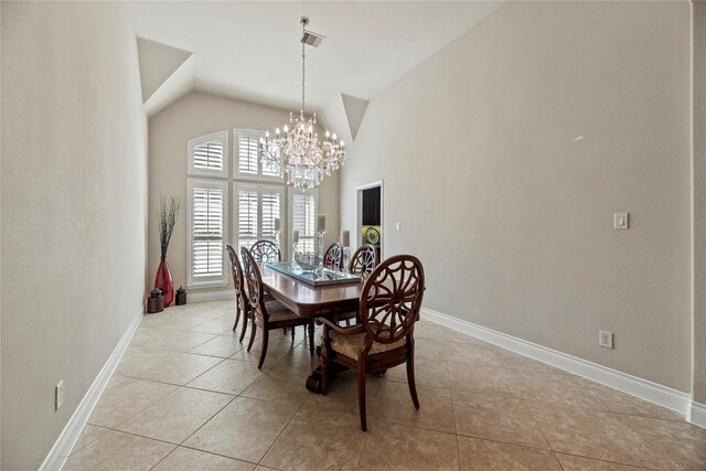 dining space with light tile patterned floors, baseboards, and a chandelier