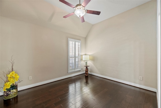 empty room with baseboards, lofted ceiling, ceiling fan, and wood finished floors