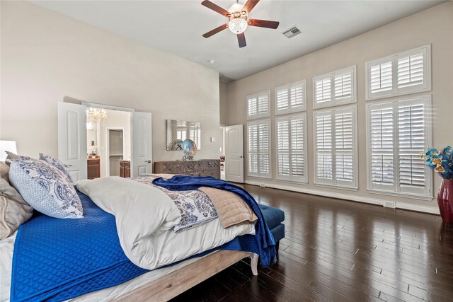 bedroom with visible vents, multiple windows, wood finished floors, and a ceiling fan