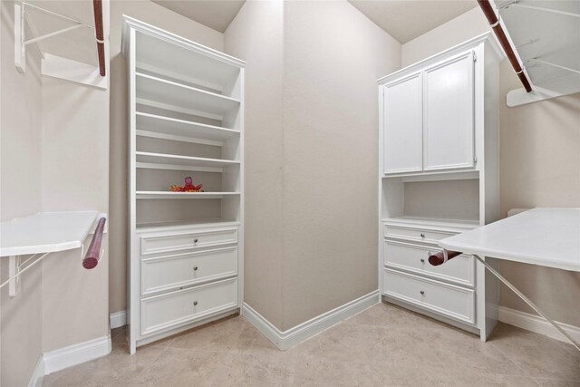 walk in closet featuring light tile patterned floors